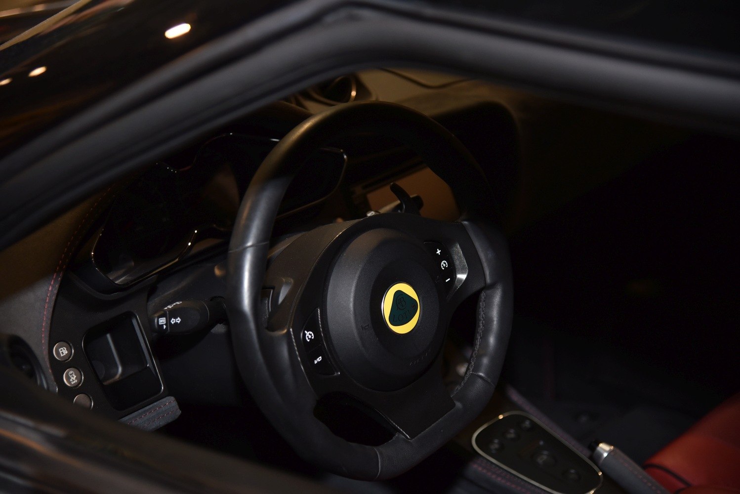 Close-up of Lotus Evora S steering wheel and dashboard controls