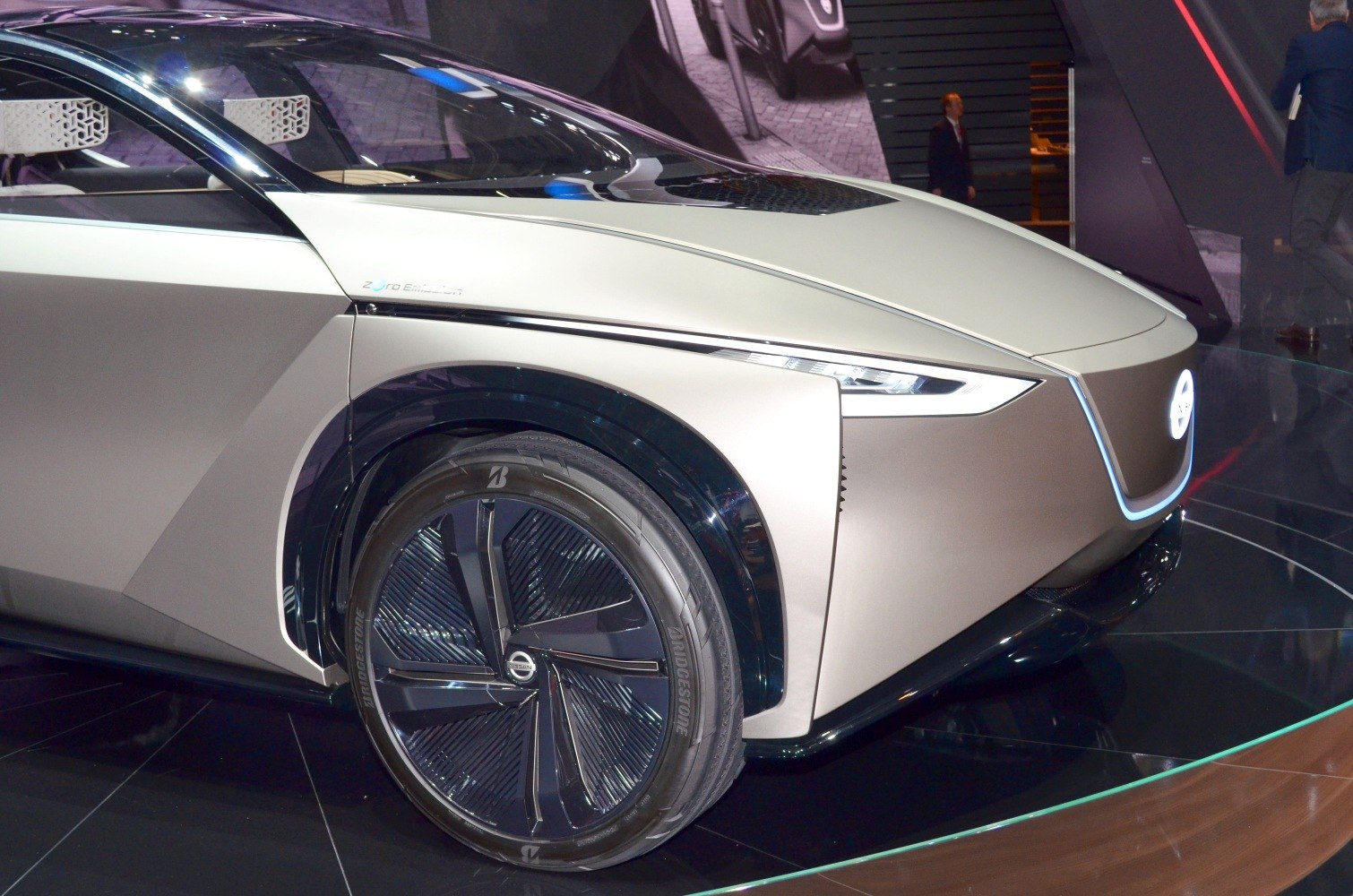 Futuristic front design with sleek headlights and unique black alloy wheel