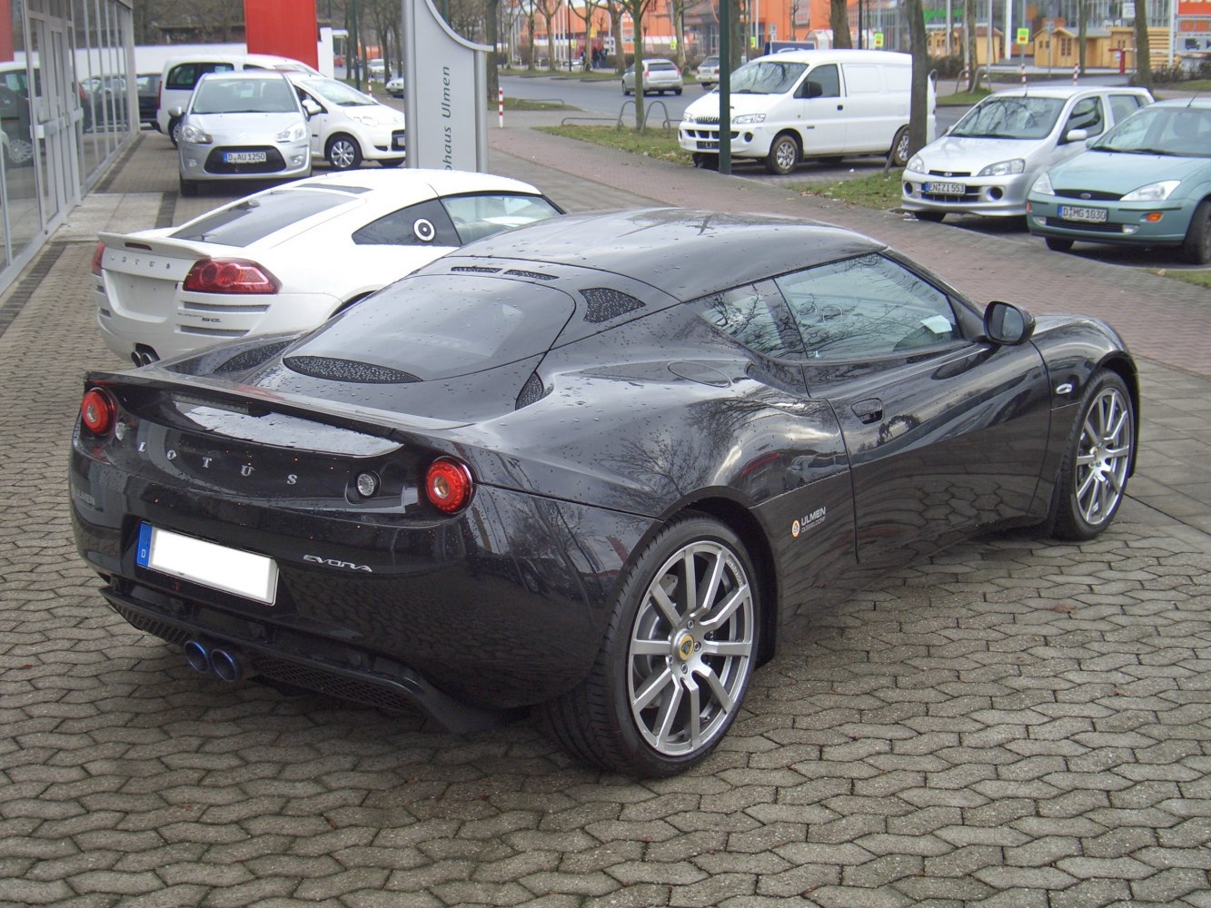Rear view with round taillights and dual exhaust pipes