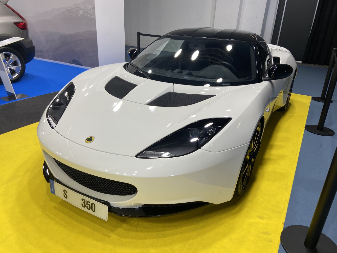Front view of sports coupe with aerodynamic hood vents and sleek headlights