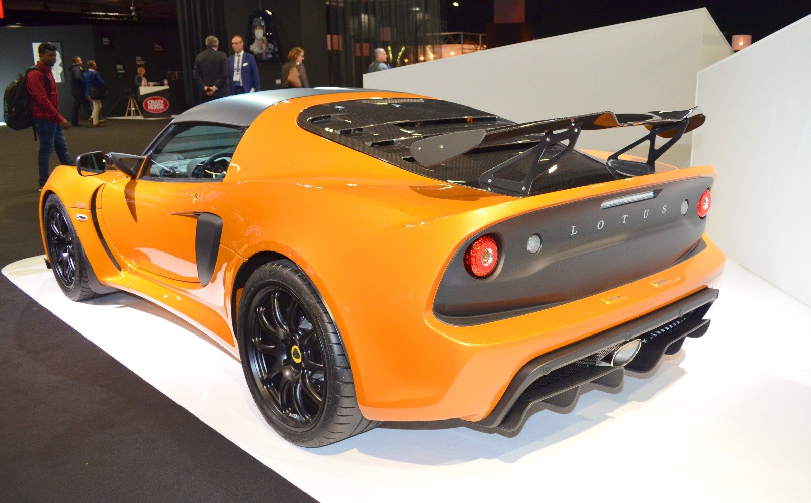 Rear and side view with large spoiler and black wheels