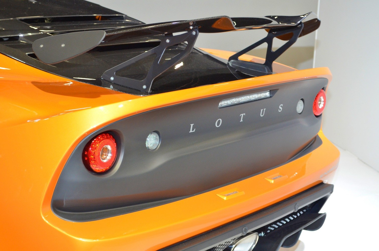 Rear wing and tail lights close-up on sporty vehicle