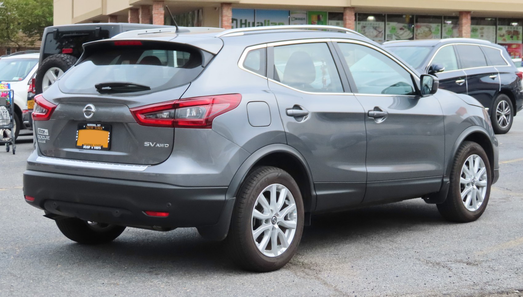 Rear-side view with AWD badge and taillights on compact SUV