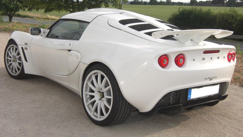 White Lotus sports coupe rear with spoiler and round red tail lights