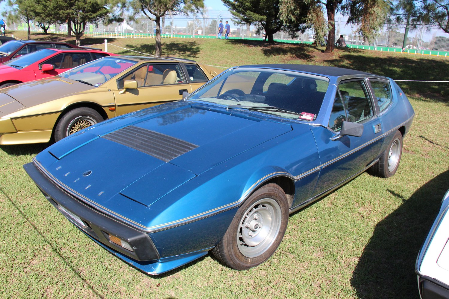 1970s sports coupe with pop-up headlights and rear hatchback design