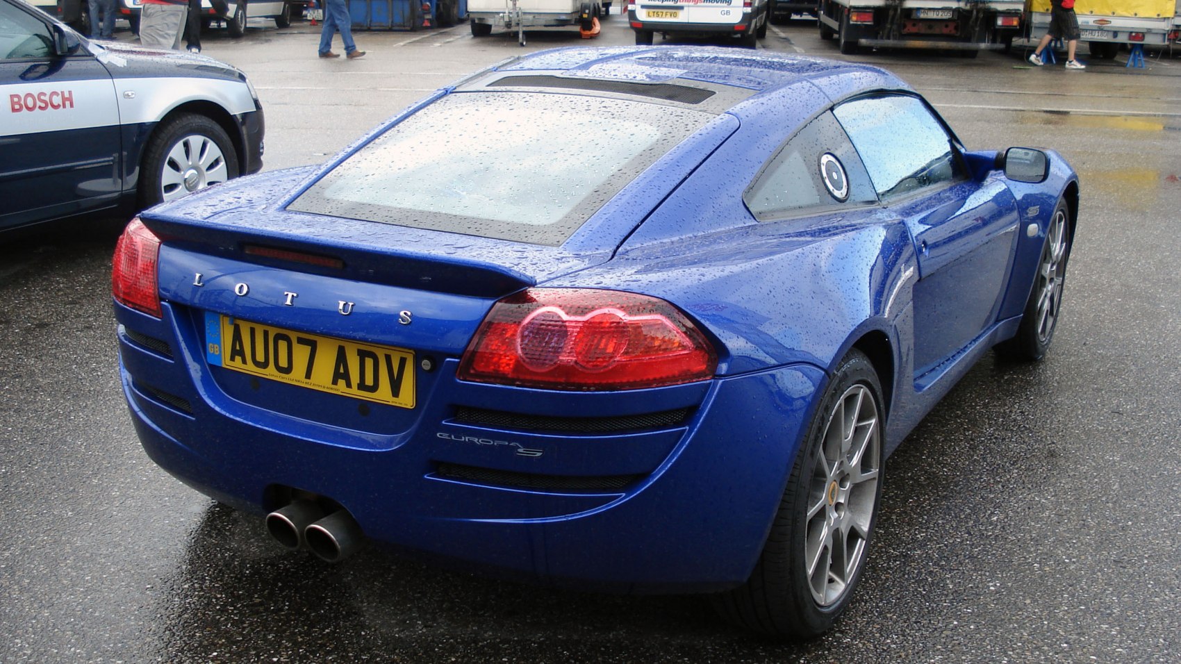 Rear view of sporty coupe with dual exhaust and distinctive taillights