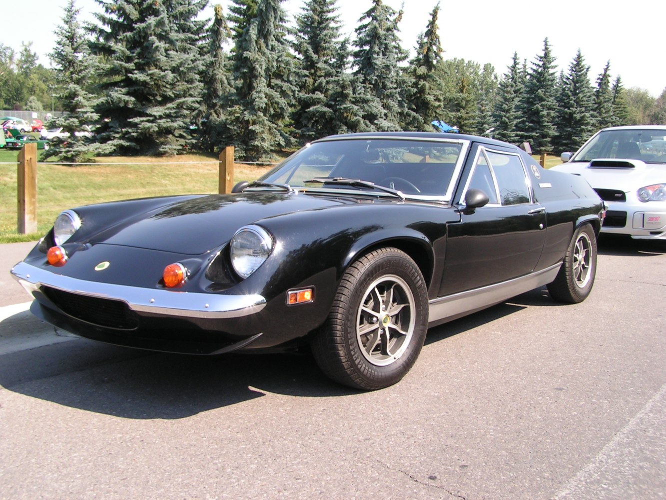 Vintage sports coupe with pop-up headlights and sleek body design