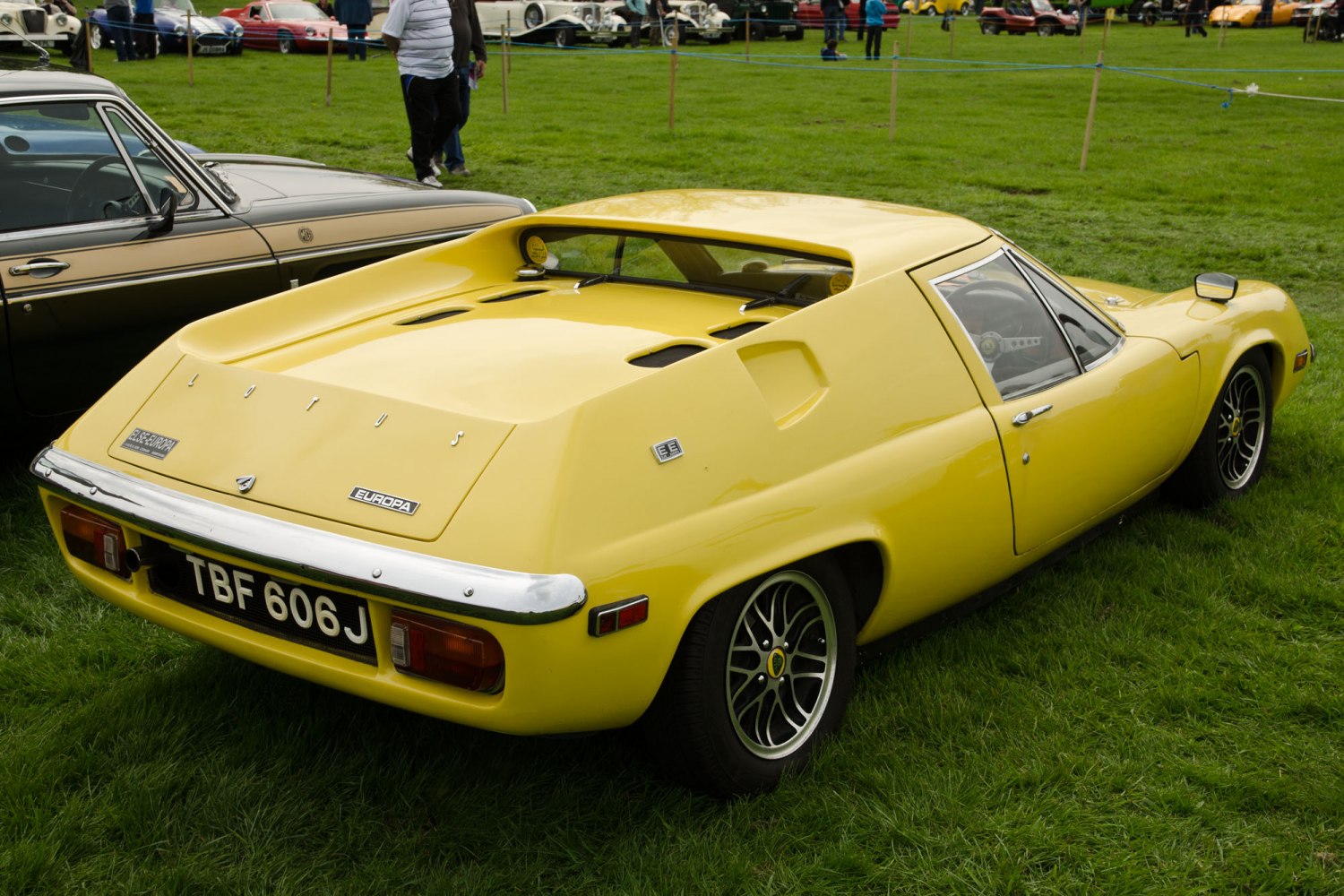 Yellow vintage sports coupe rear side with unique design elements