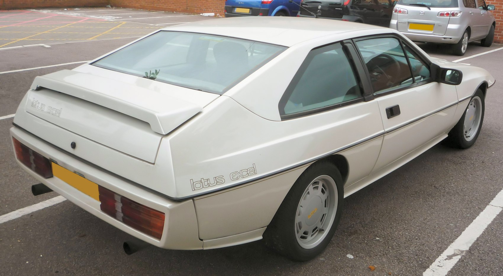 Angular rear and side view with integrated spoiler and vintage styling