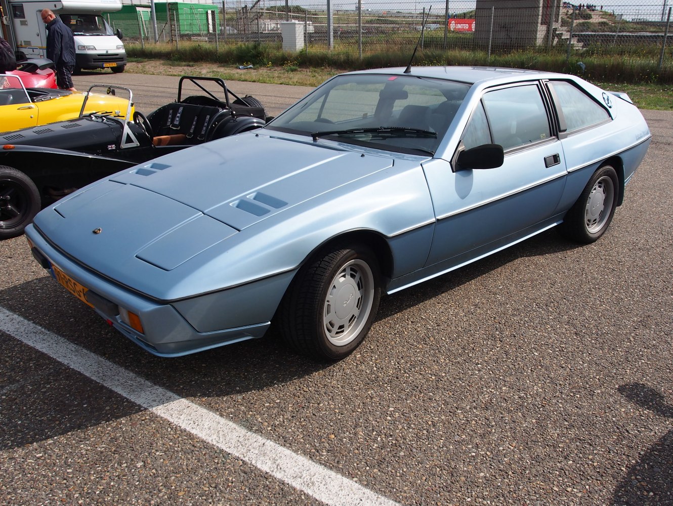 Classic 1980s sports coupe with pop-up headlights and angular body.