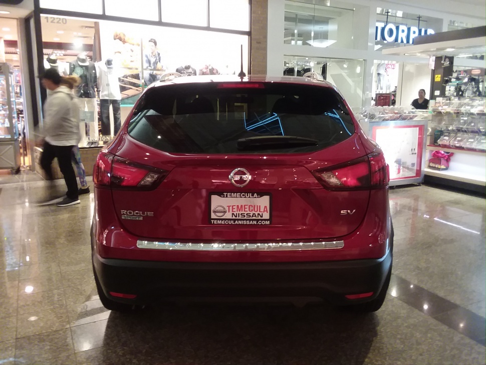 Rear view of a red SUV with distinctive taillights and SV trim badge