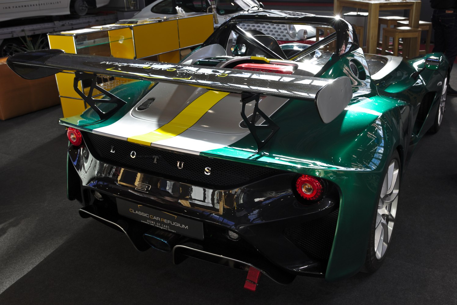 Rear view with large carbon fiber spoiler and aerodynamic design