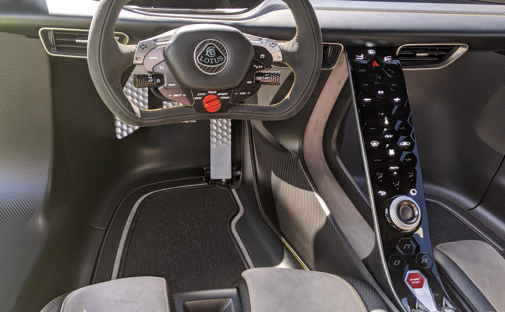 Futuristic steering wheel and sleek center console controls