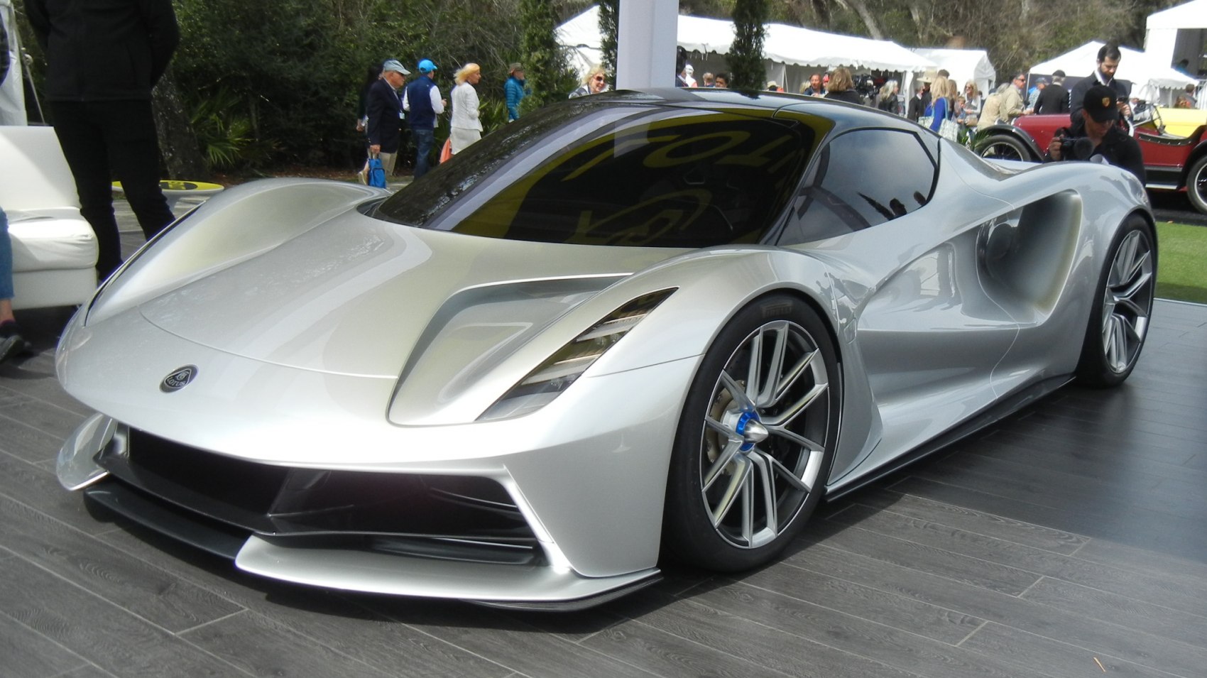 Sleek silver hypercar with aerodynamic curves and large alloy wheels