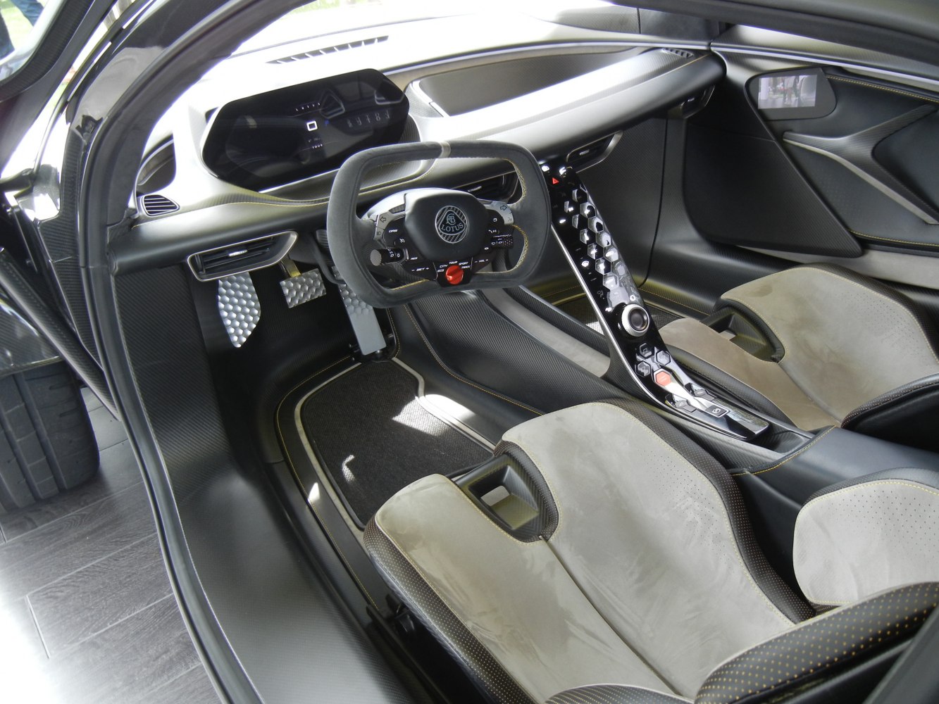 Futuristic steering wheel and advanced center control panel in luxury sports interior