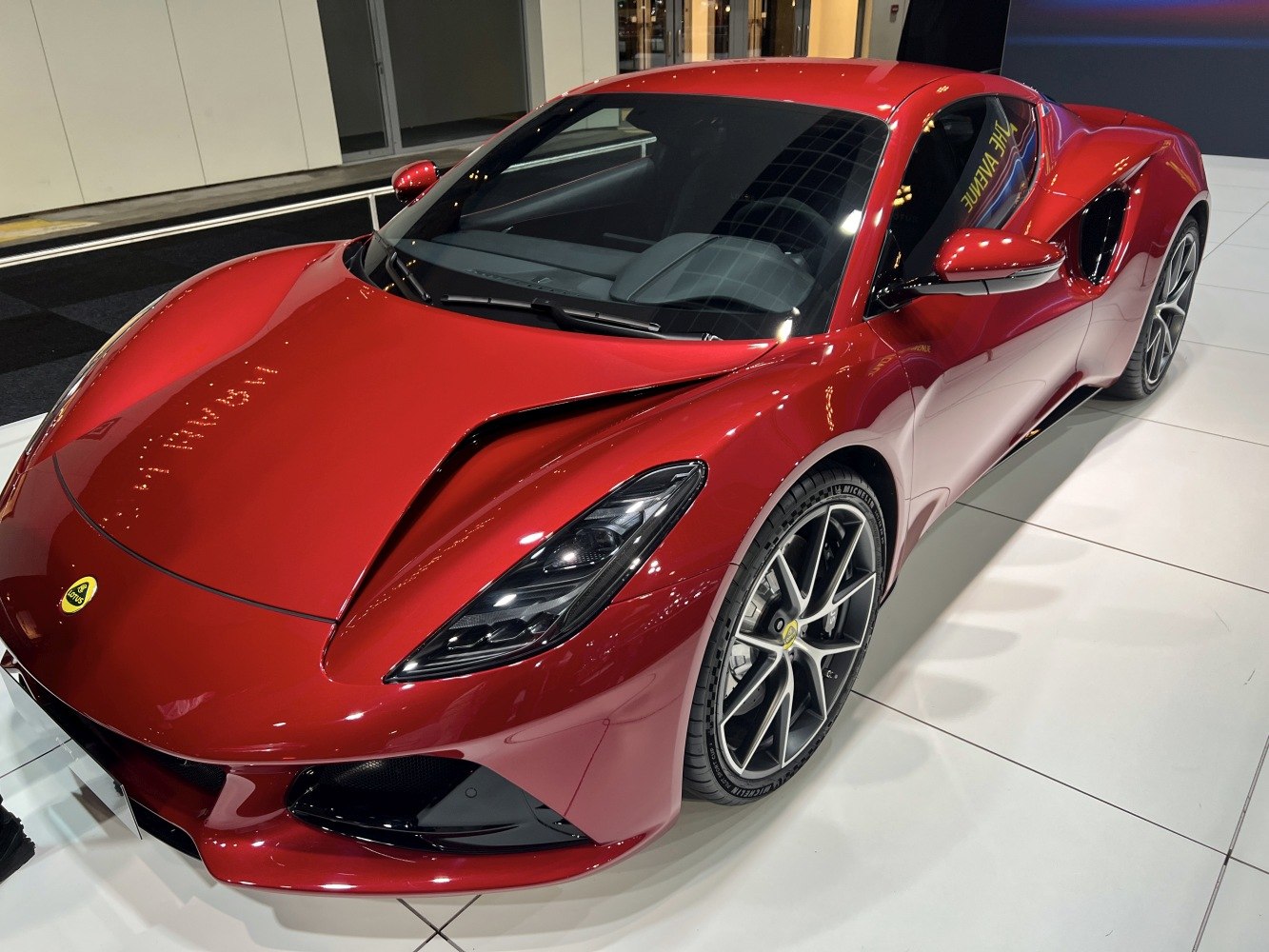 Red sports car with sleek headlights and sporty alloy wheels