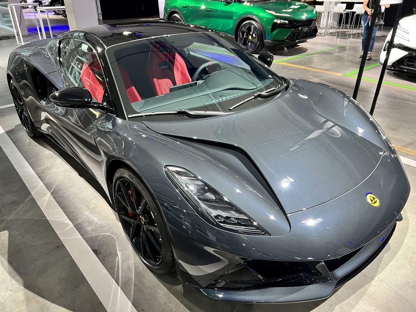 Front view of a sleek sports coupe with red interior and aerodynamic design
