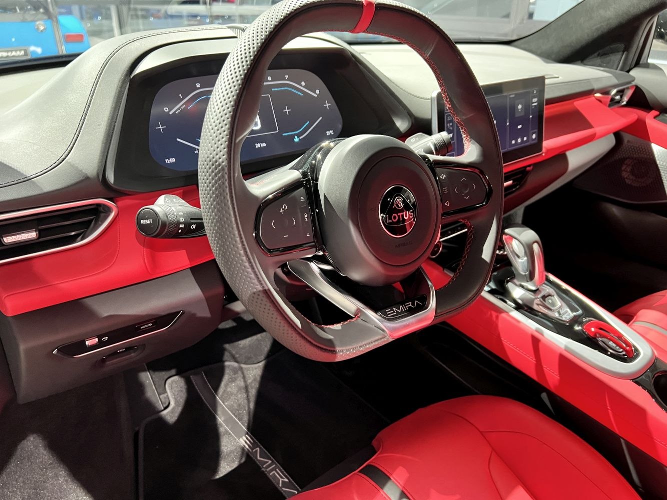 Digital instrument cluster and multifunction steering wheel in luxury sports car interior