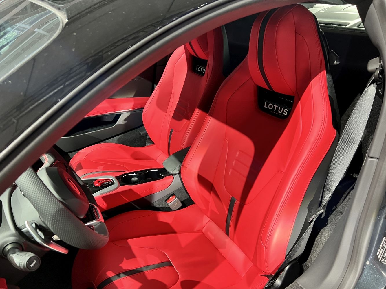 Red leather racing-style bucket seats with Lotus branding