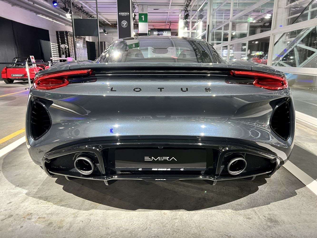 Sleek rear with dual exhausts and distinctive taillights