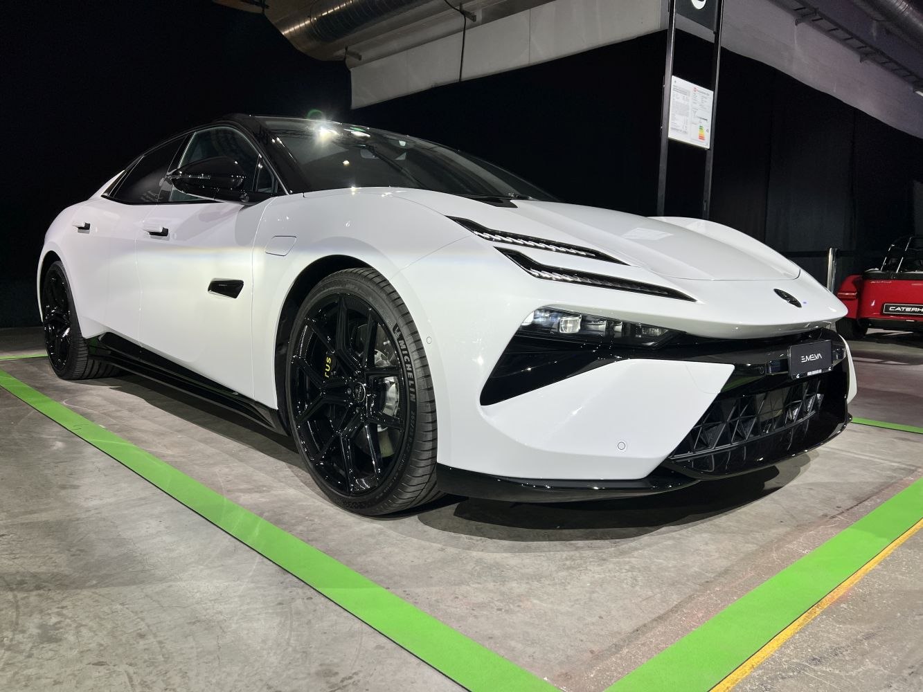 Sharp LED headlights and black alloy wheels from front-side view