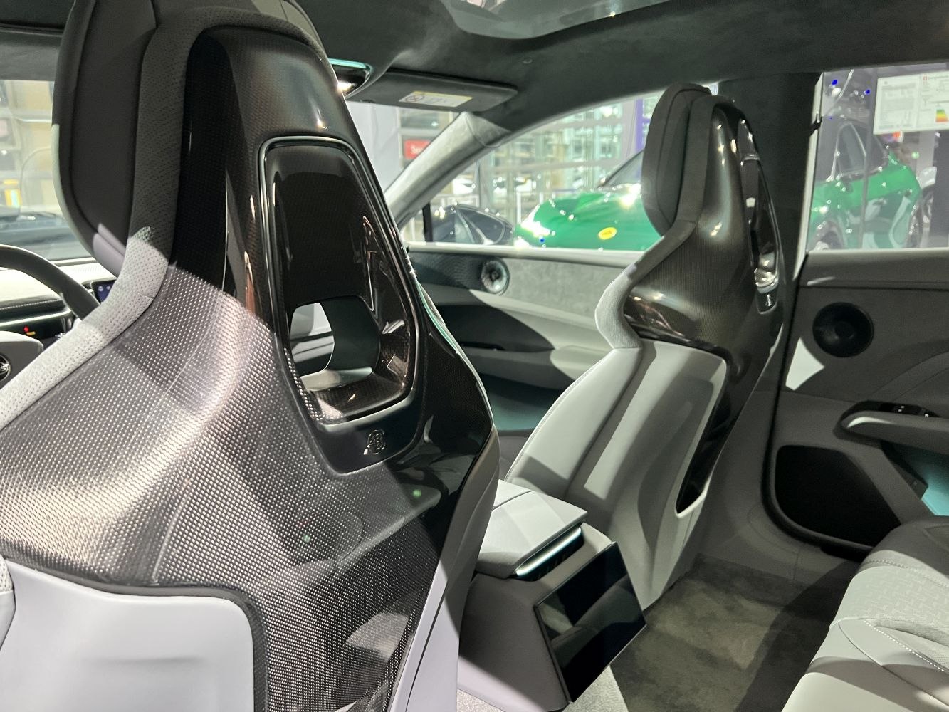 Sporty carbon fiber-backed racing seats with premium upholstery.