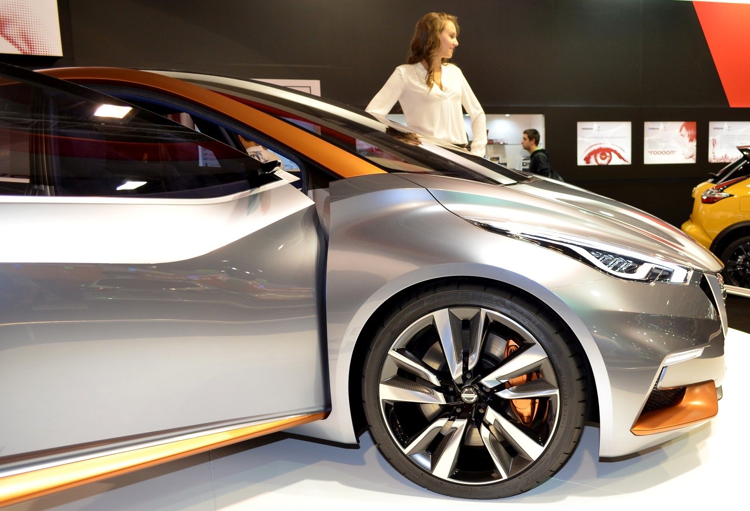 Futuristic front wheel and sleek headlight design with open door