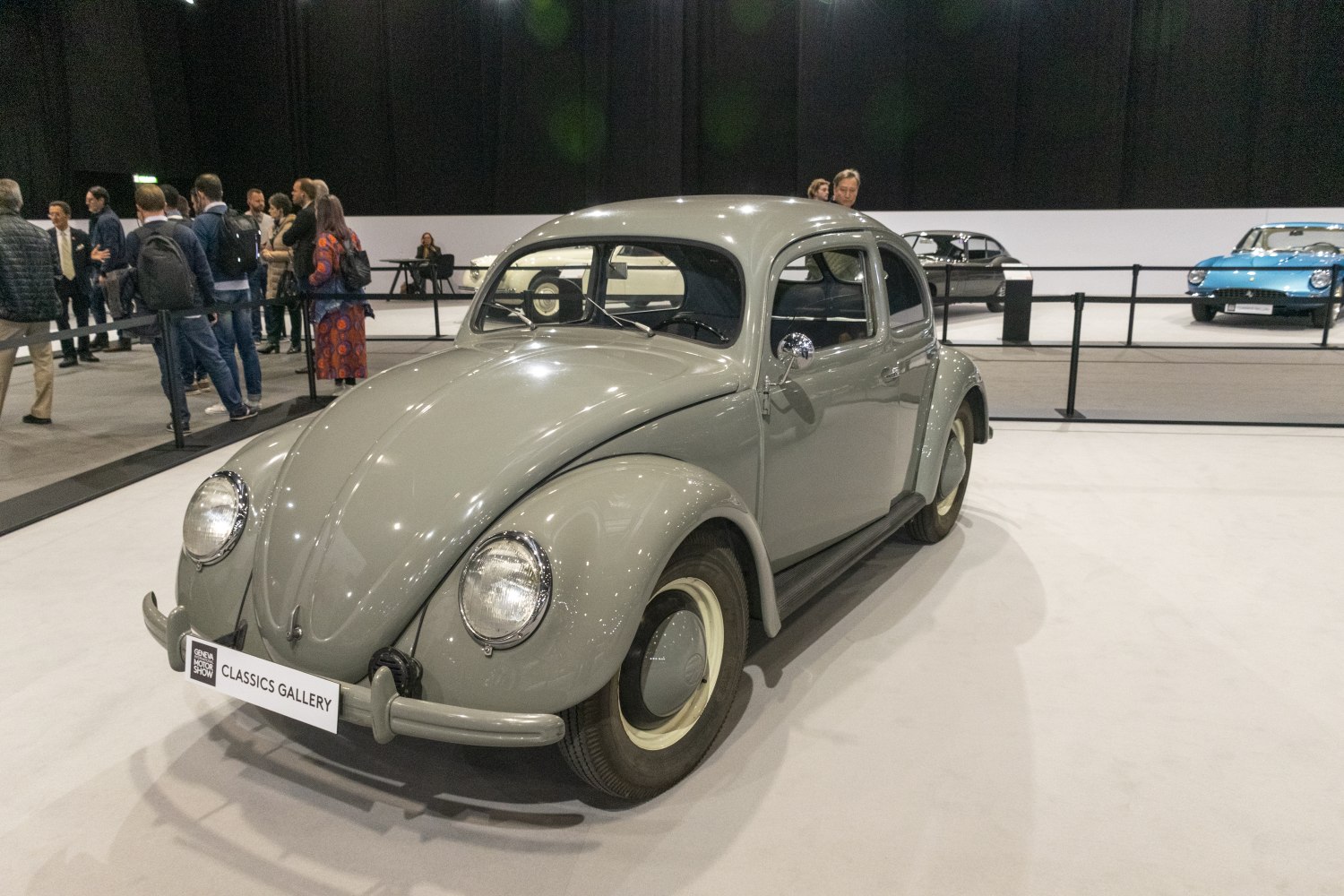 Classic rounded headlights, smooth curved vintage vehicle front.
