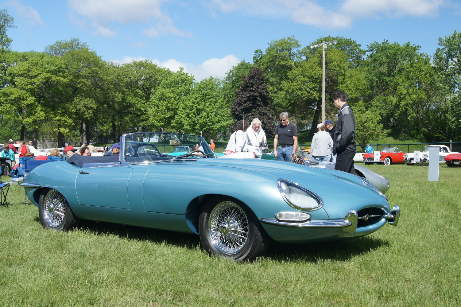 Vintage convertible sports car with wire wheels and rounded headlights