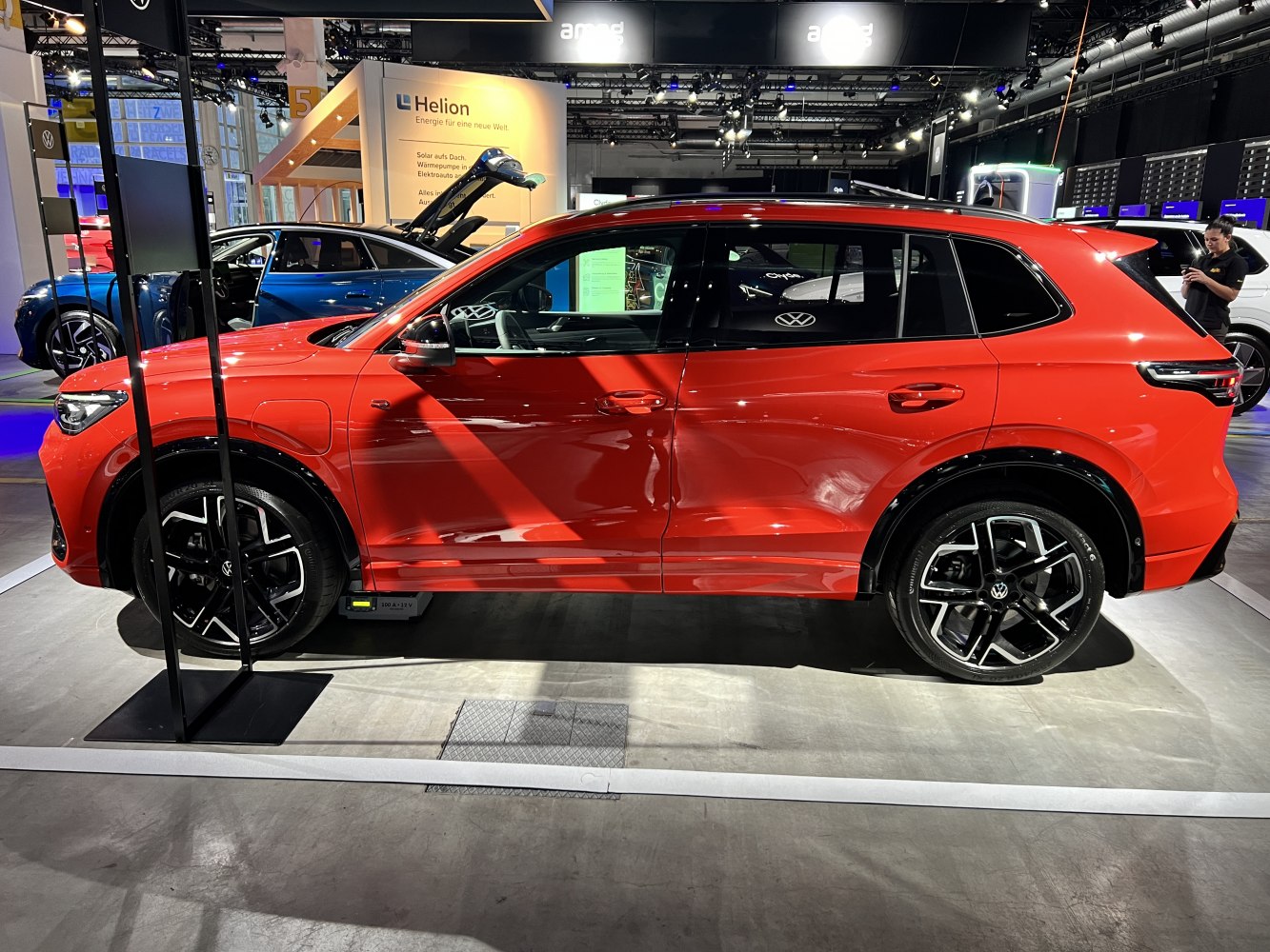 Side profile of red SUV with modern alloy wheels
