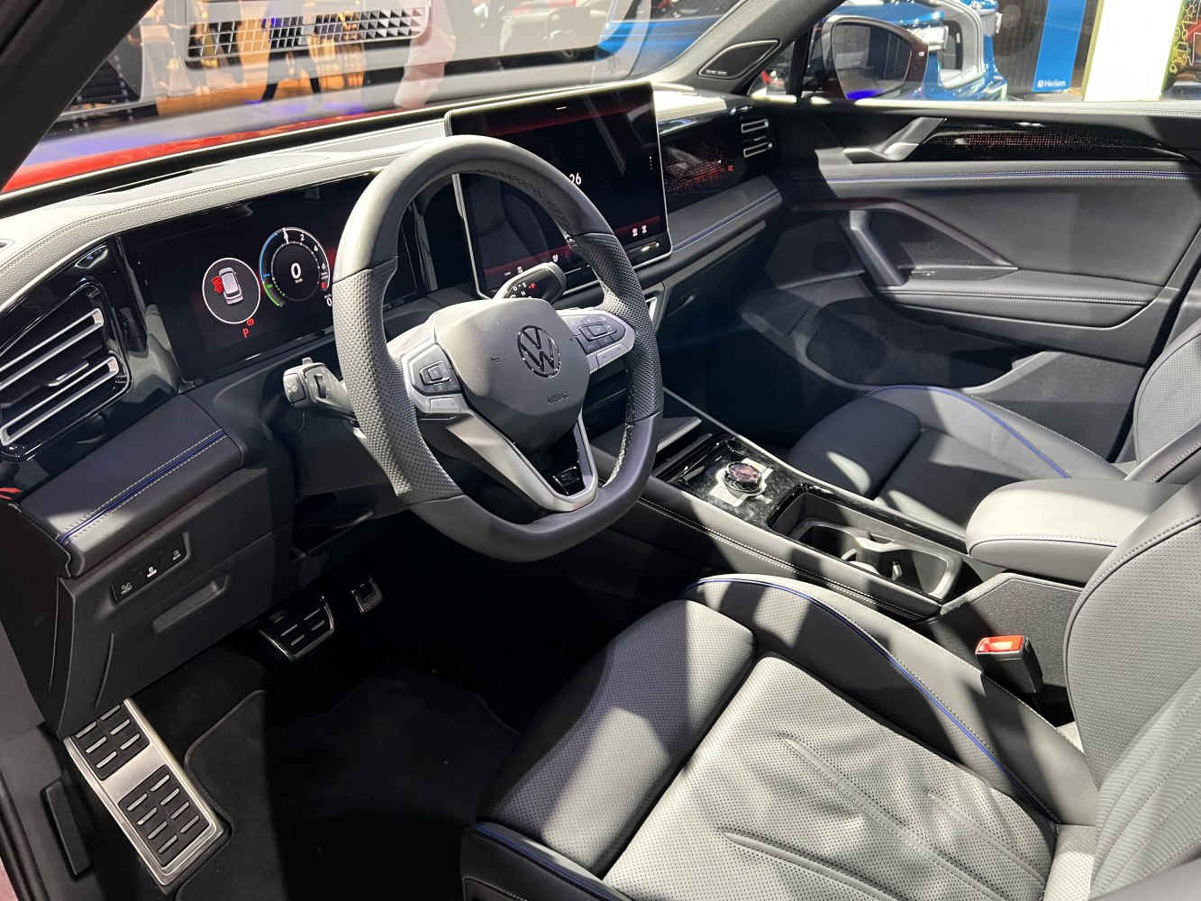 Digital dashboard, touchscreen infotainment, modern steering wheel