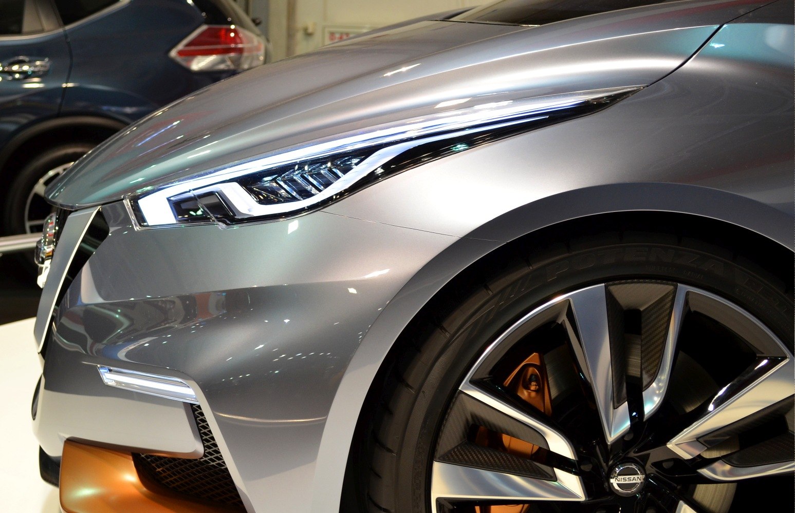LED headlights and alloy wheel with carbon fiber accents and orange brake calipers
