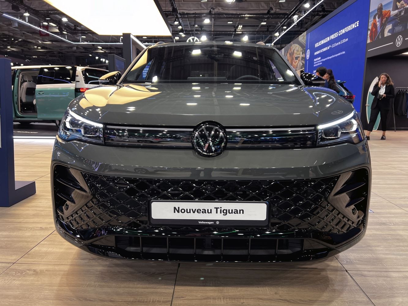 Front view with LED headlights and black mesh grille