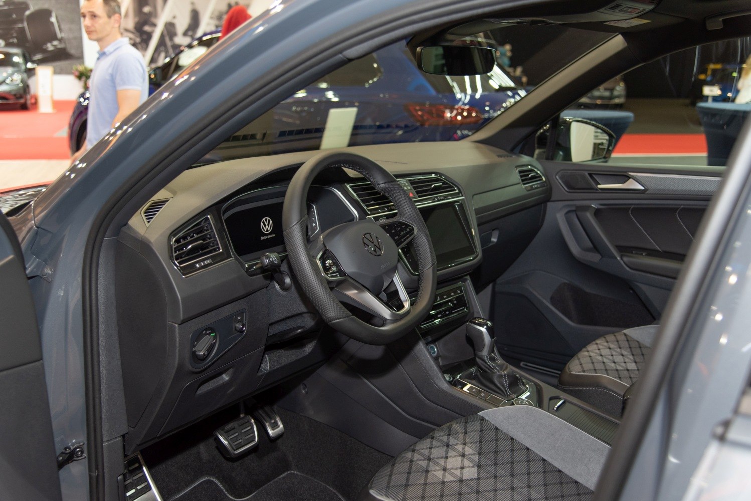 Modern vehicle interior with digital dashboard and multifunction steering wheel