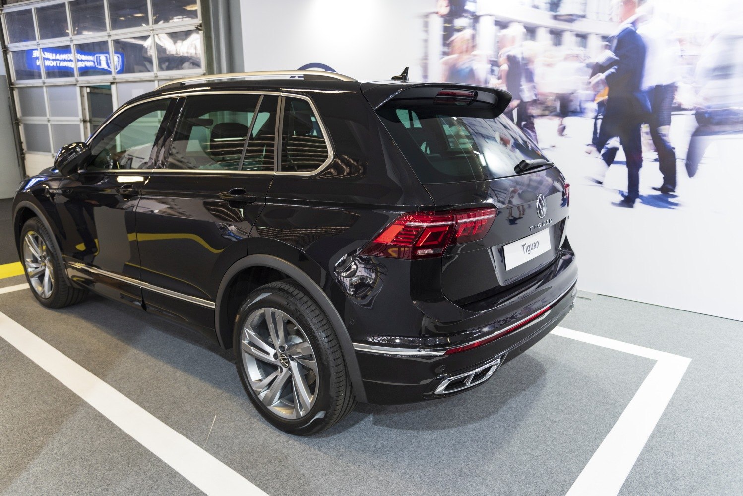 Sleek rear and side profile with alloy wheels and taillights