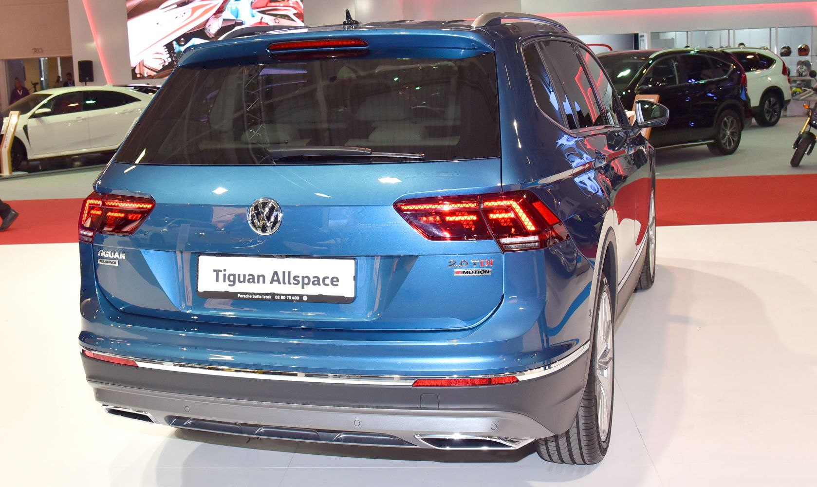Rear view of a modern SUV with LED taillights and wide trunk door.