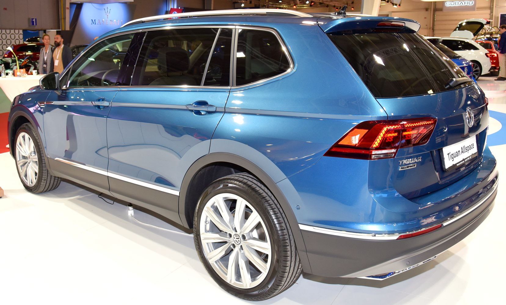 Side and rear view of a blue midsize SUV with LED rear lights and alloy wheels