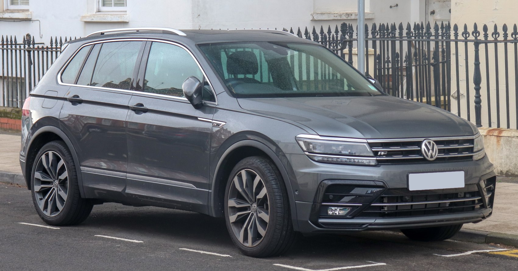Grey SUV with alloy wheels and sharp LED headlights