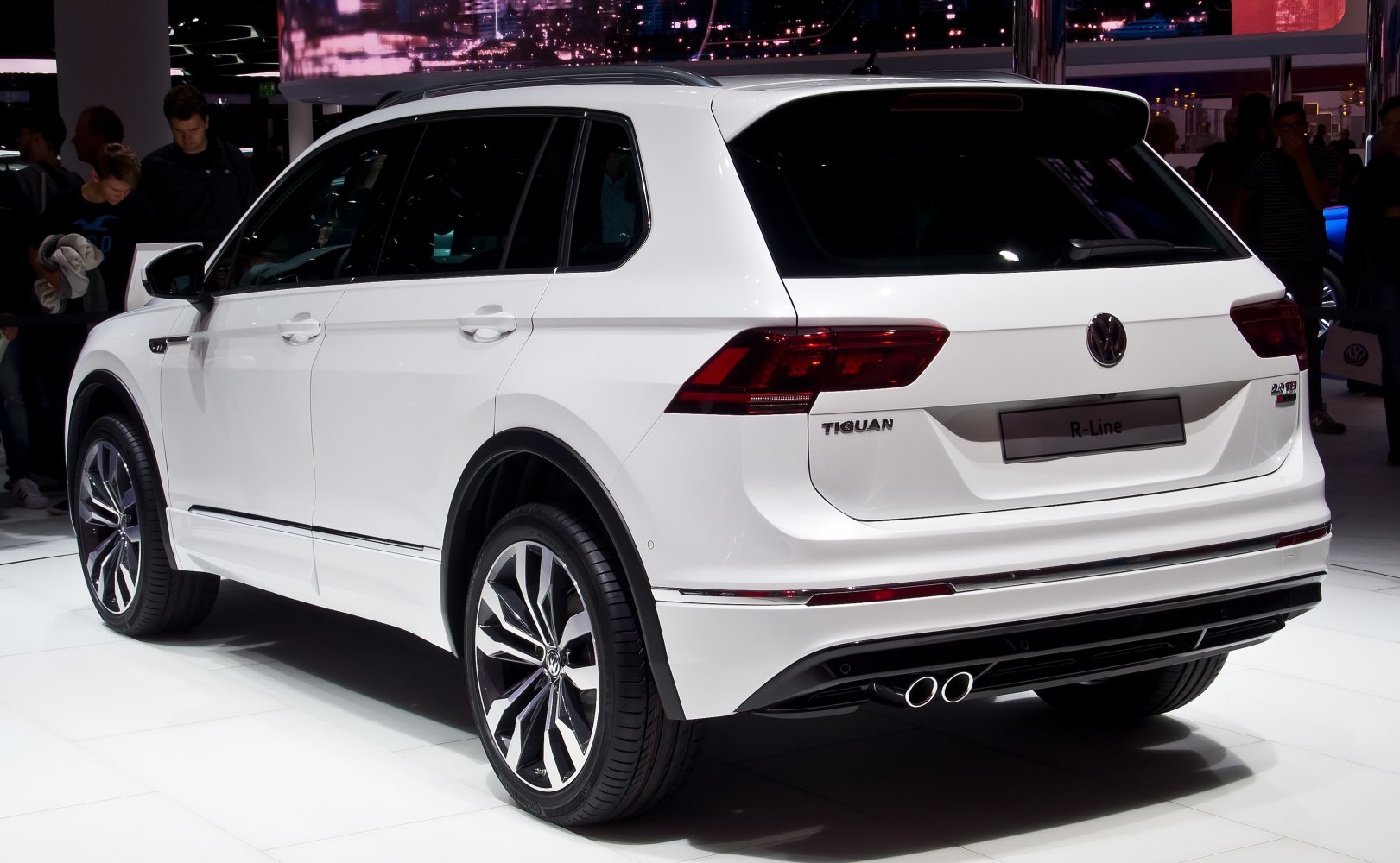 Rear and side view of SUV with dual exhaust and modern taillights