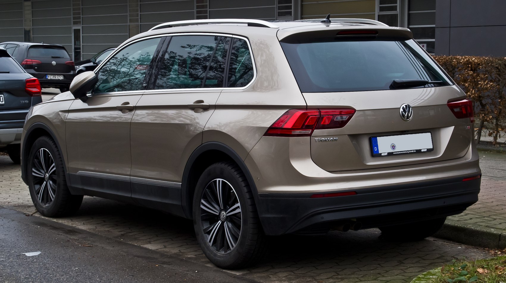 Rear side view of an SUV showing taillights and alloy wheels