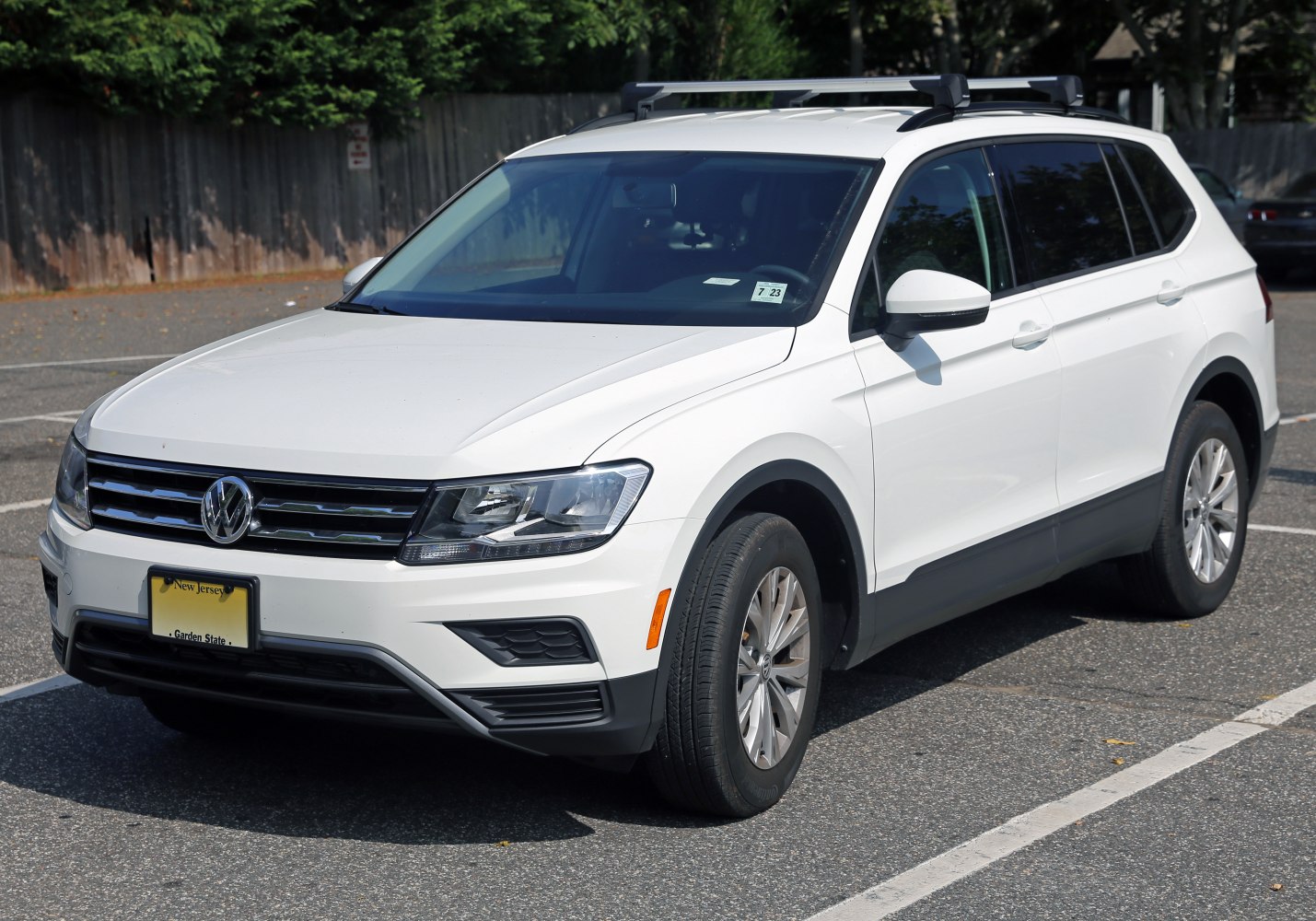 White SUV with roof rails and LED headlights