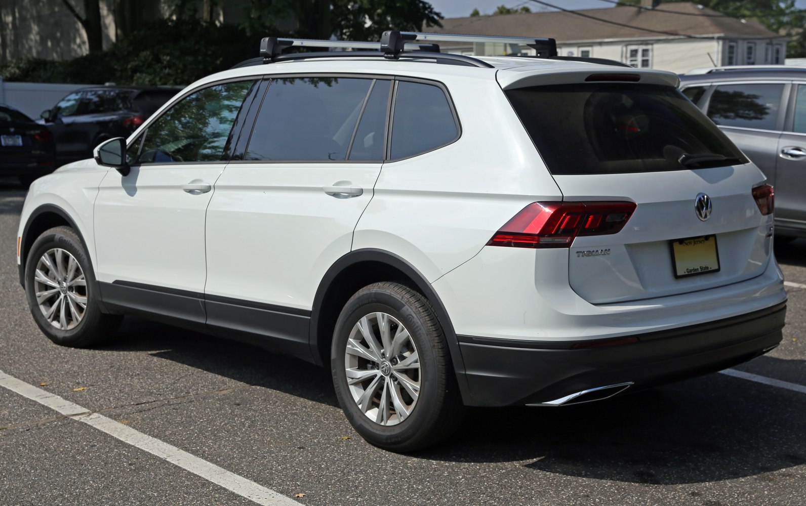 Rear side view of SUV with roof rails and alloy wheels