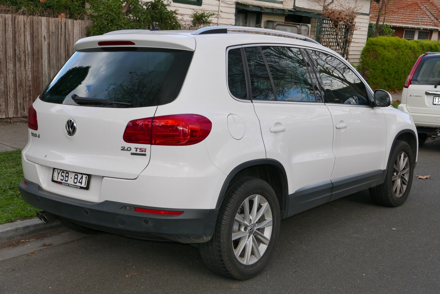 White compact SUV rear and side profile with tinted windows and alloy wheels.