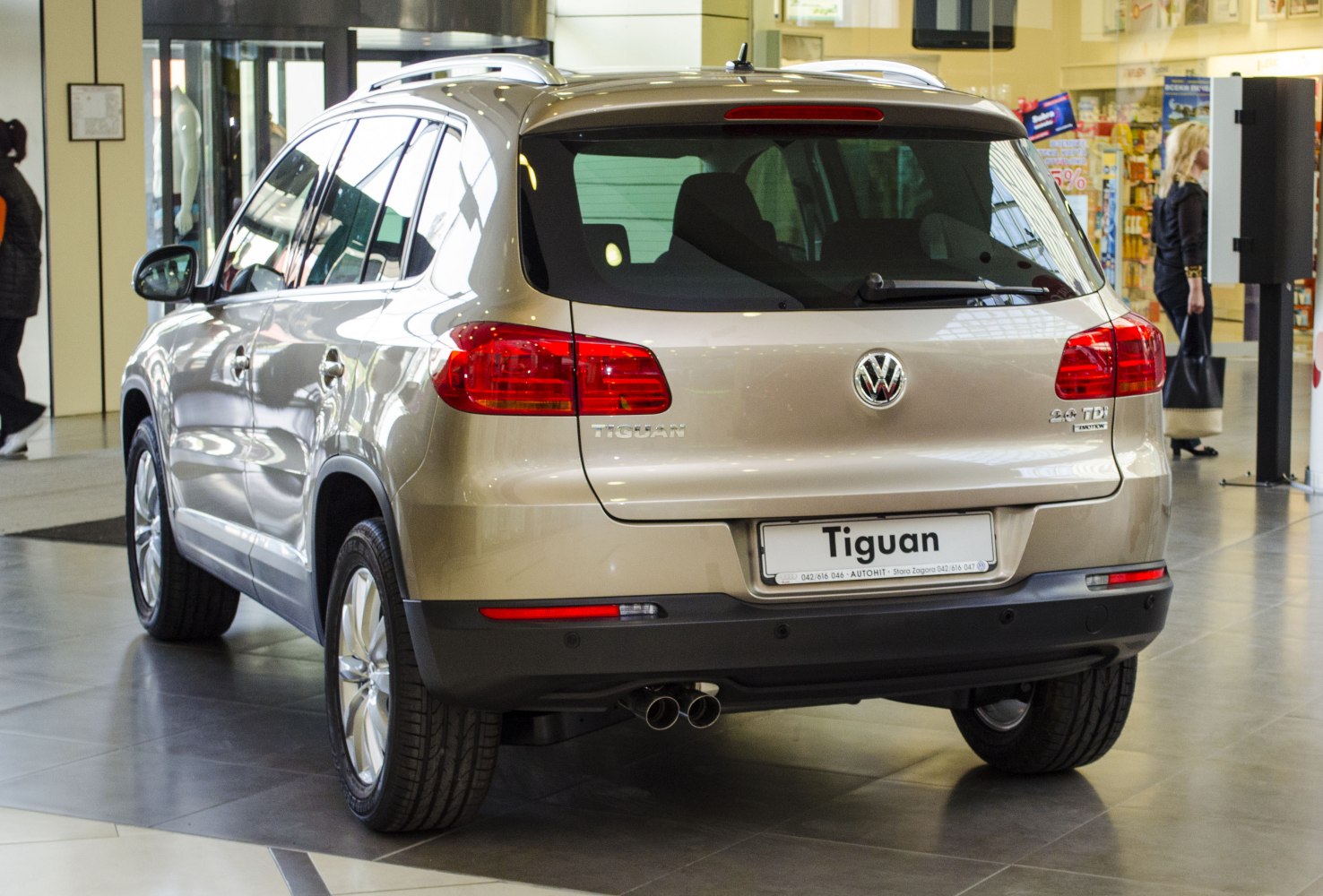 Rear view with taillights and dual exhaust pipes