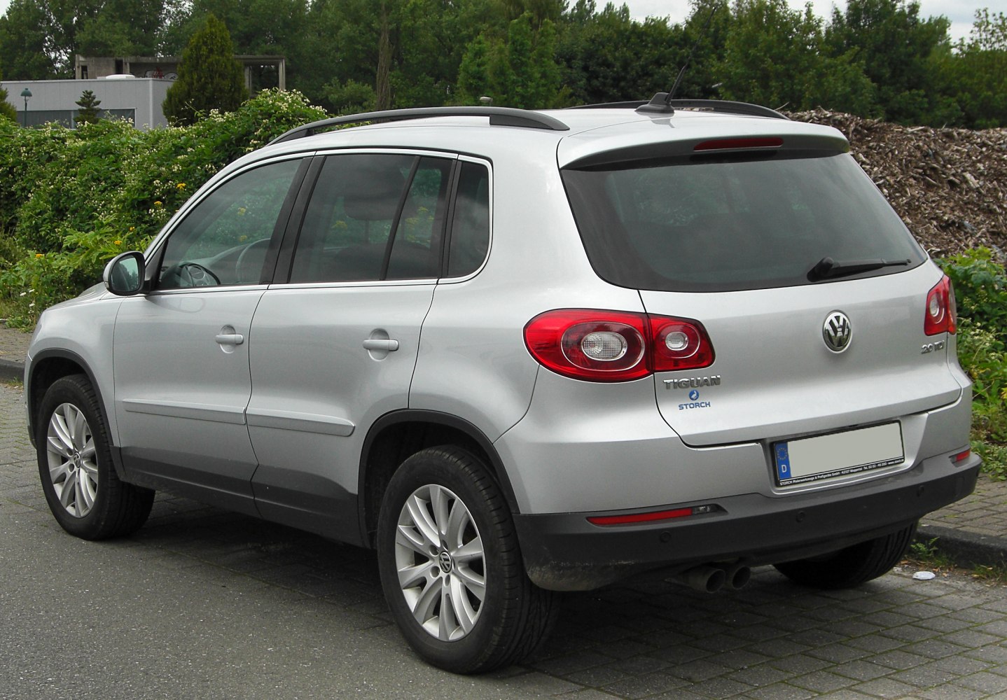 Compact SUV side and rear view with distinctive taillights and roof rails