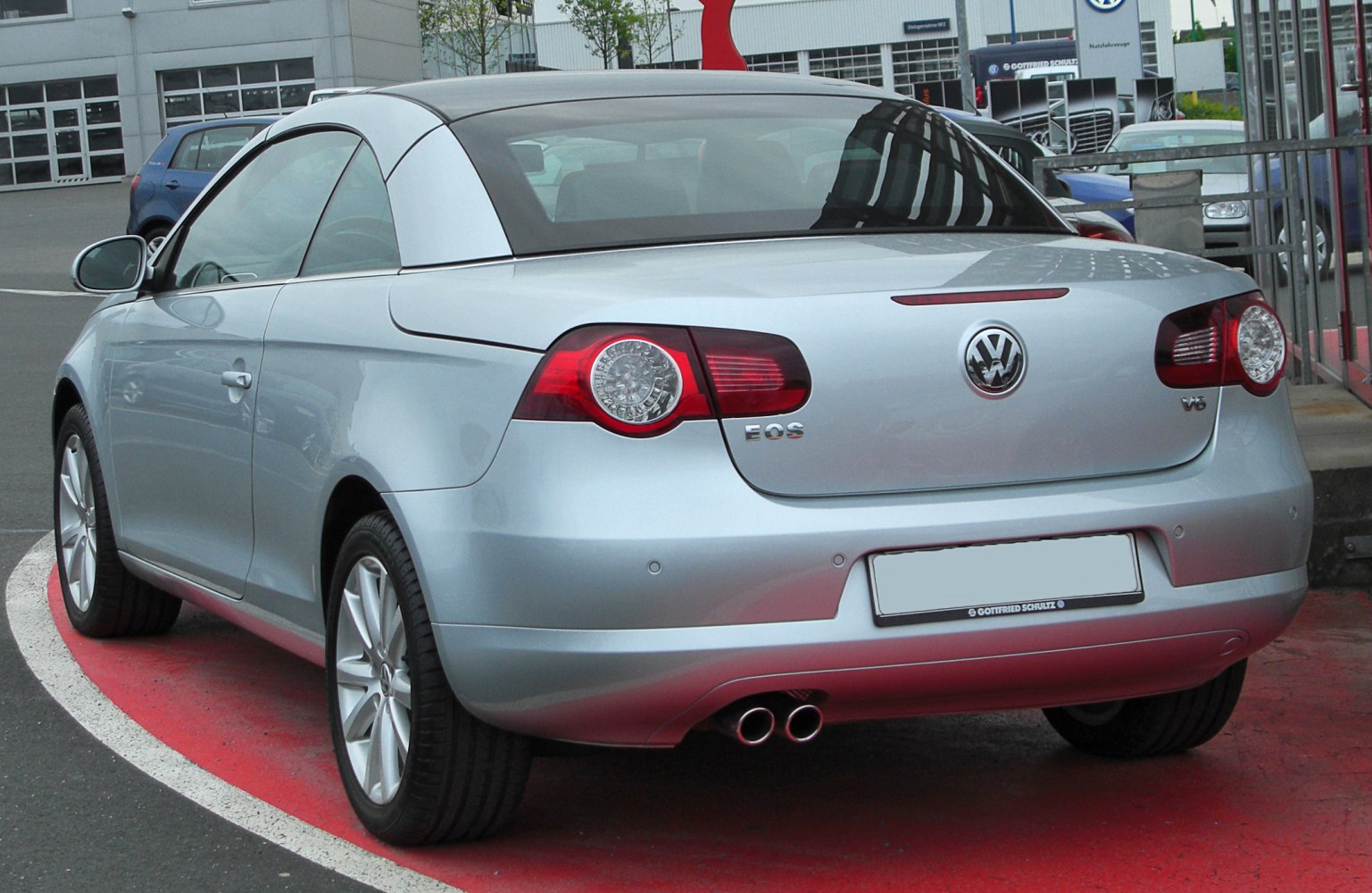 Rear view of convertible with dual exhaust and distinctive taillights