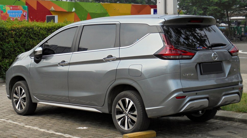 Rear side view of a 2019 modern MPV with sleek taillights and tinted windows
