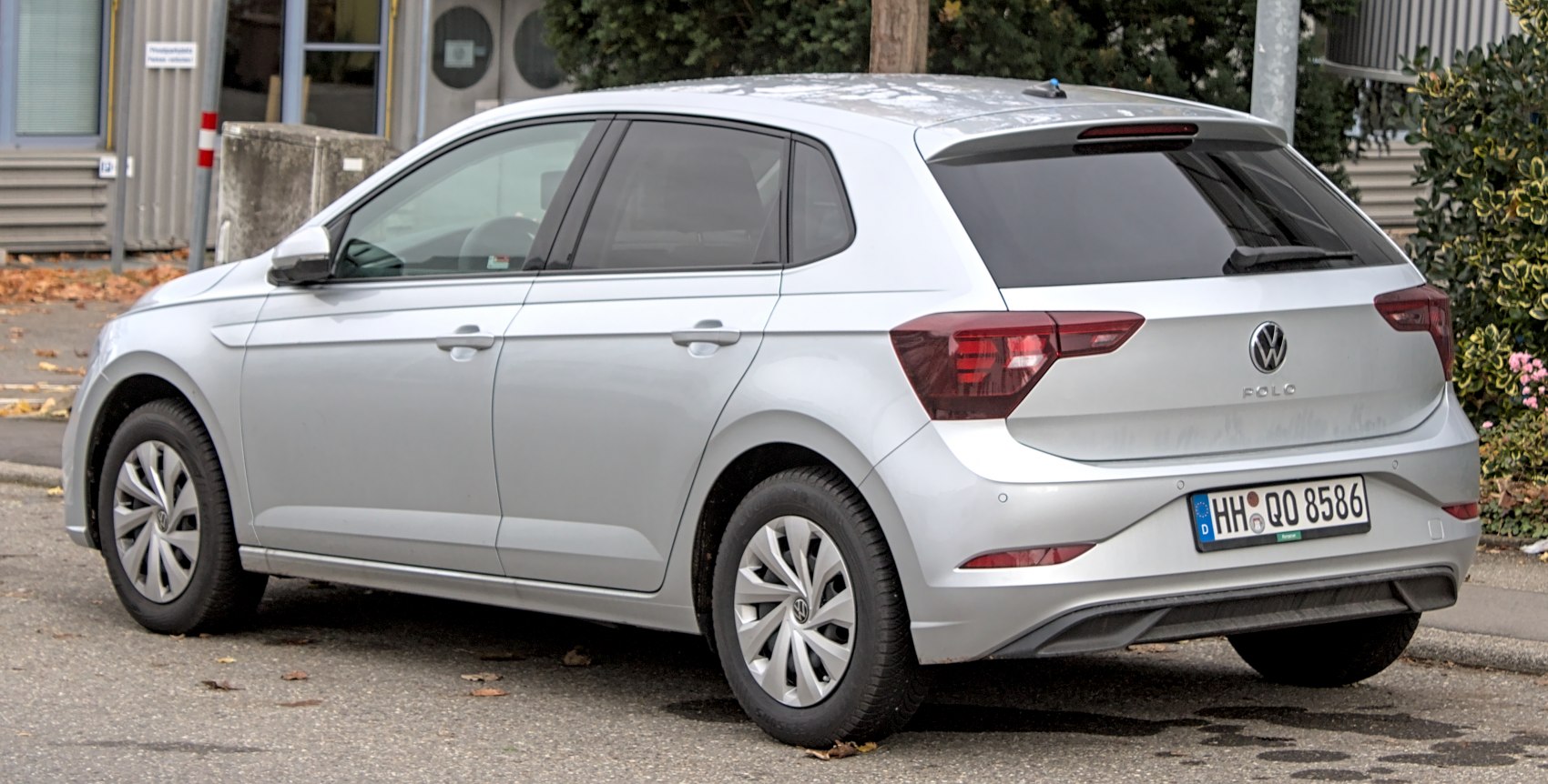Rear and side view of a silver hatchback with modern tail lights and sleek lines.