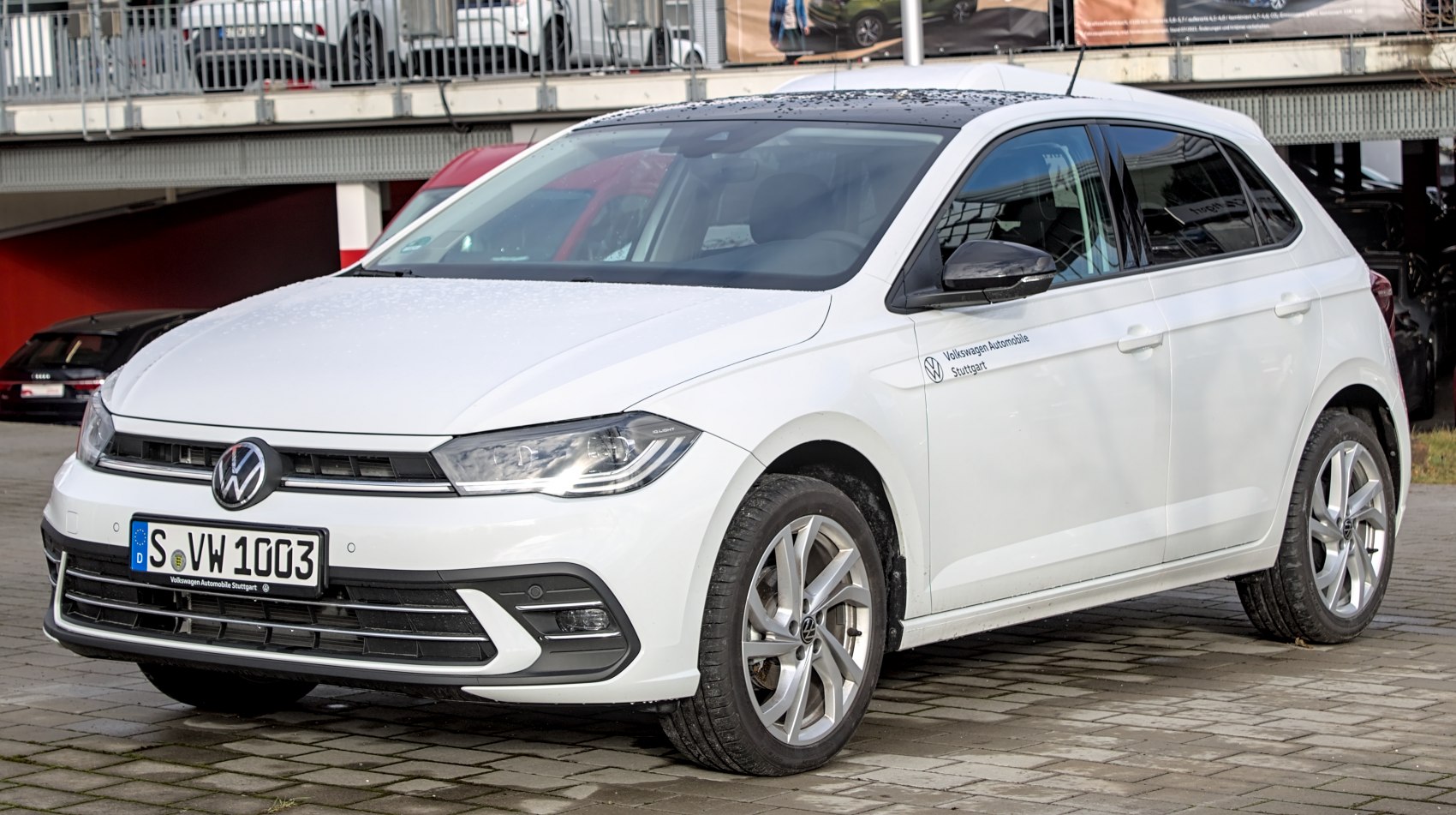 Front view of a white hatchback with LED headlights and alloy wheels