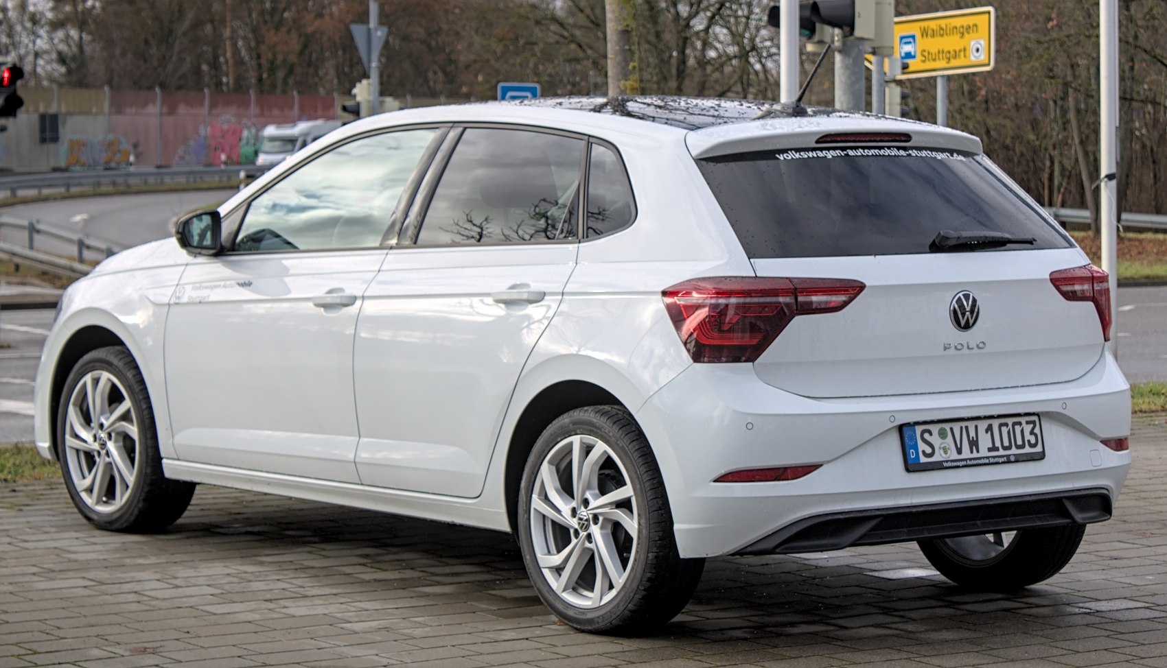 Rear and side profile of a white modern hatchback with distinctive taillights.
